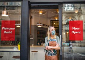 Window clings on shop window saying 